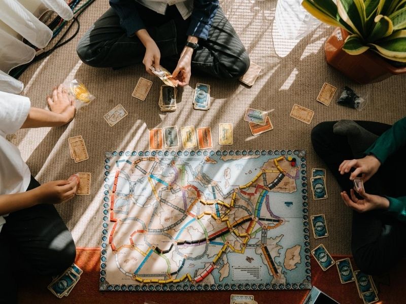 playing board game with family and friends