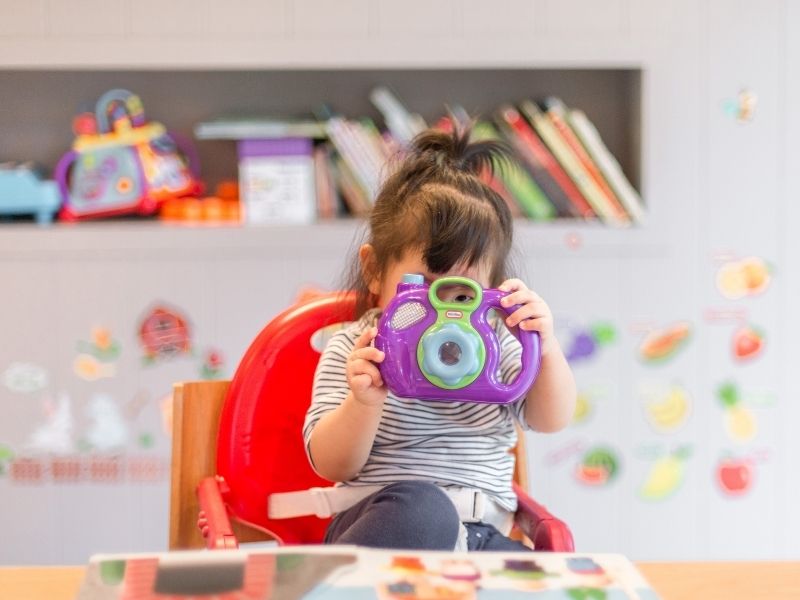 baby playing with toy, baby growth development