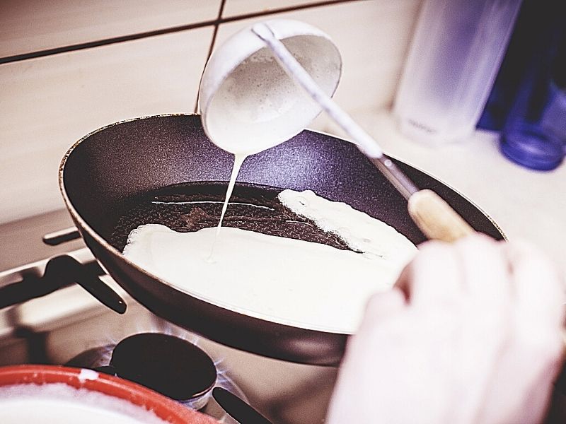 pouring batter on pan 