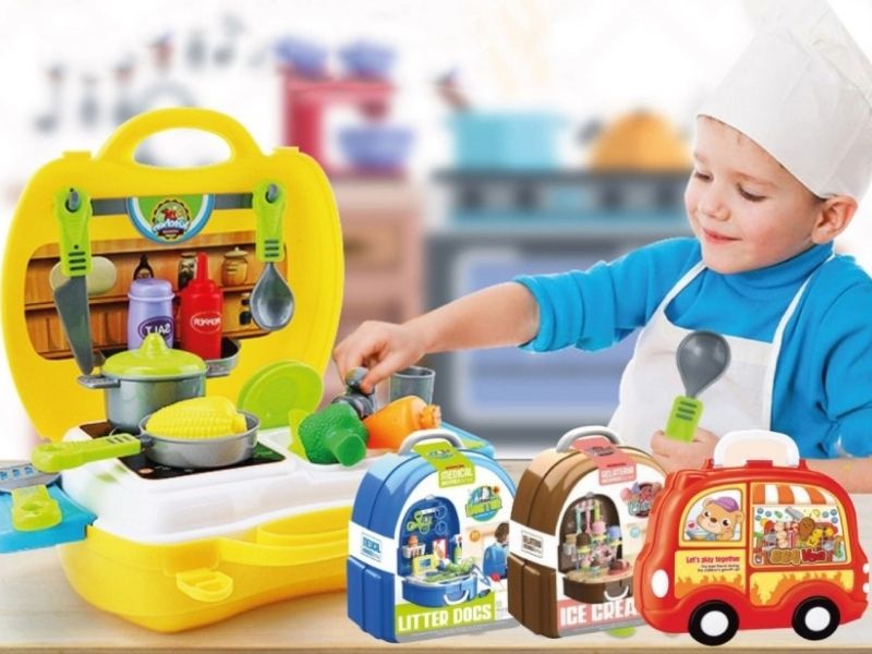 kid playing with kitchen suitcase