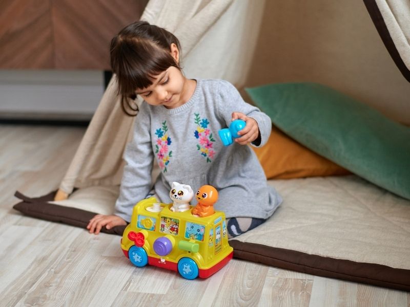 girl playing with toy
