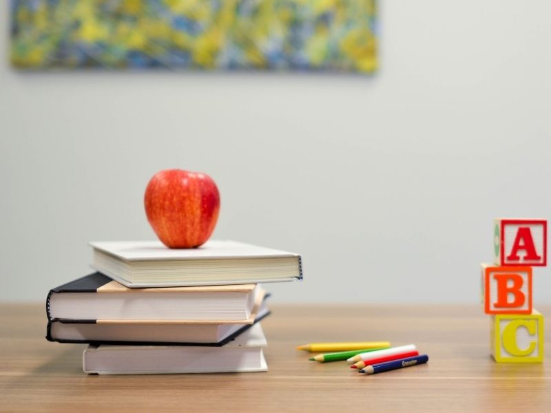 books, apple, pencils, and blocks