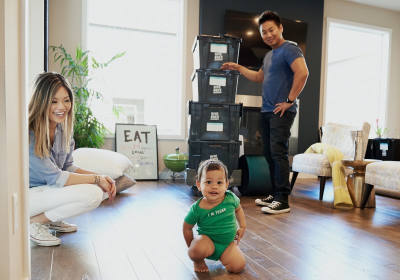 parents looking at baby, popular girl and boy names