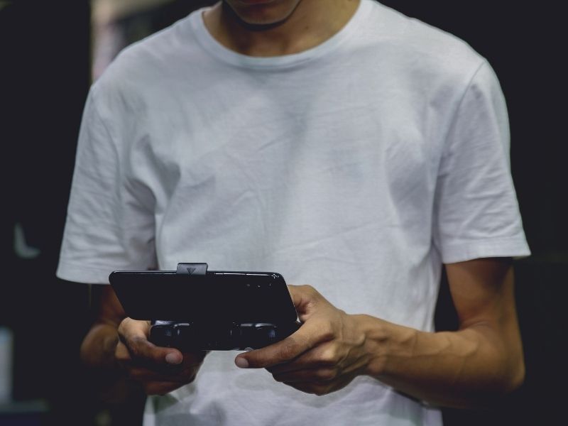 Guy playing a mobile game