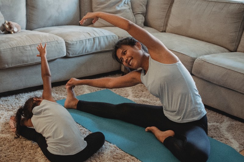 mother and daughter stretching, yoga for kids