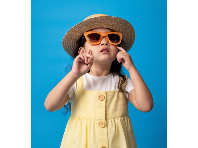 girl wearing fedora and sunglasses