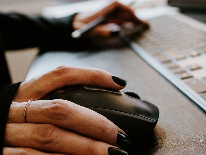 a person using a mouse and keyboard