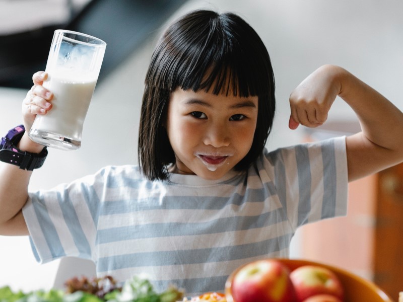 healthy food for kids, girl with glass of milk