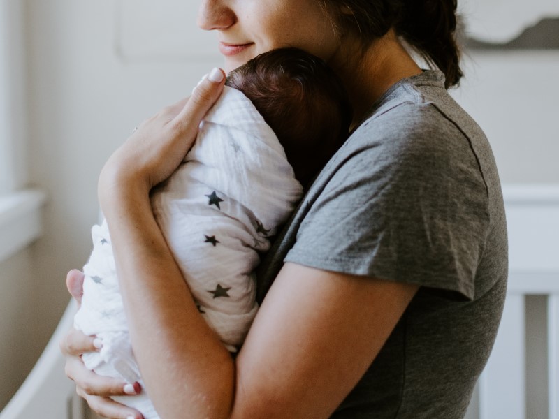 how to increase breast milk supply, mother holding baby 