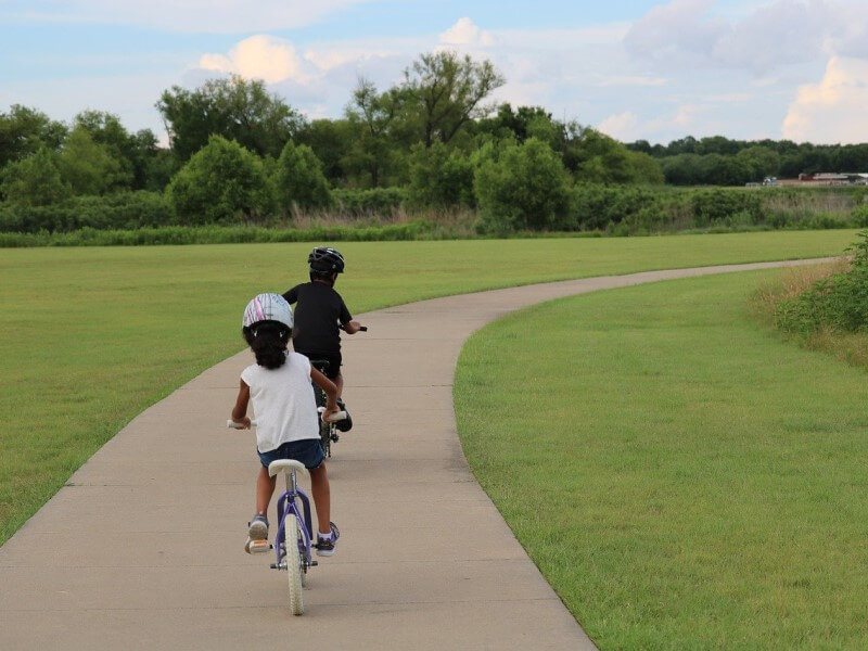 kids cycling in park