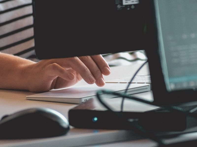 a person using a trackpad faster internet speed