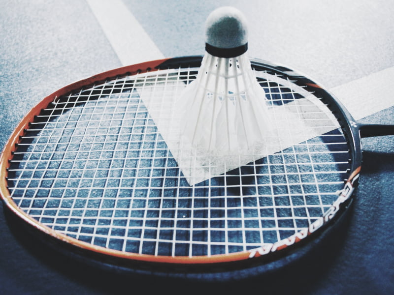 a shuttlecock on a badminton racquet