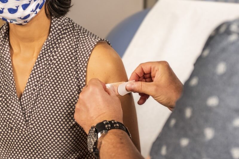 plaster on woman's arm