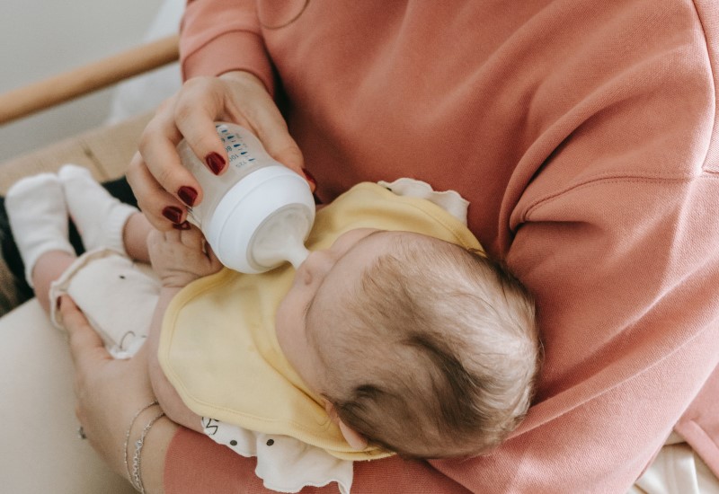 baby drinking milk from bottle