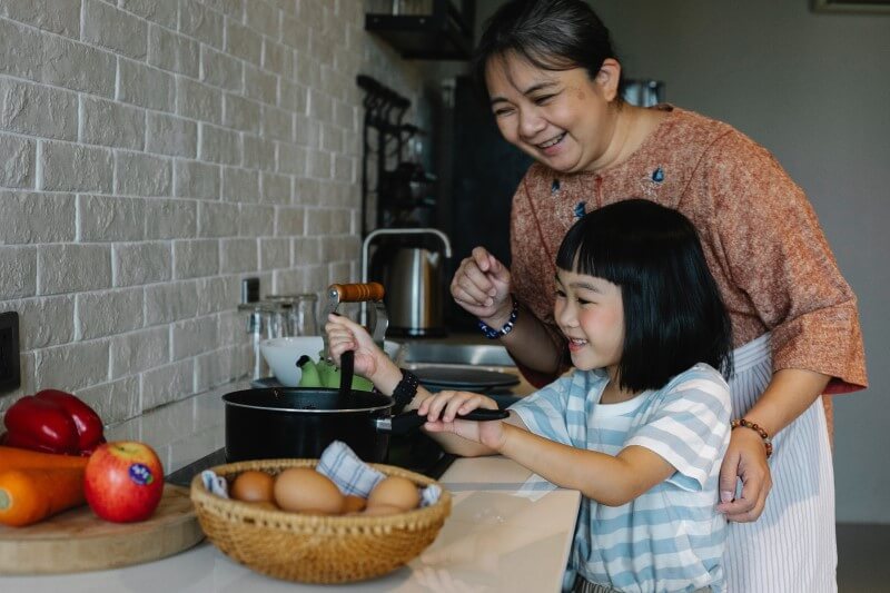 girl helping in kitchen