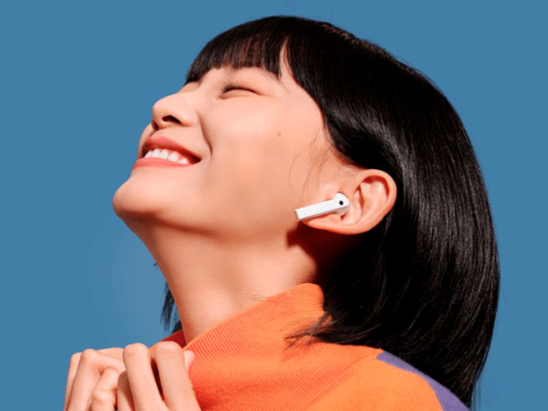 a woman with wireless earbuds