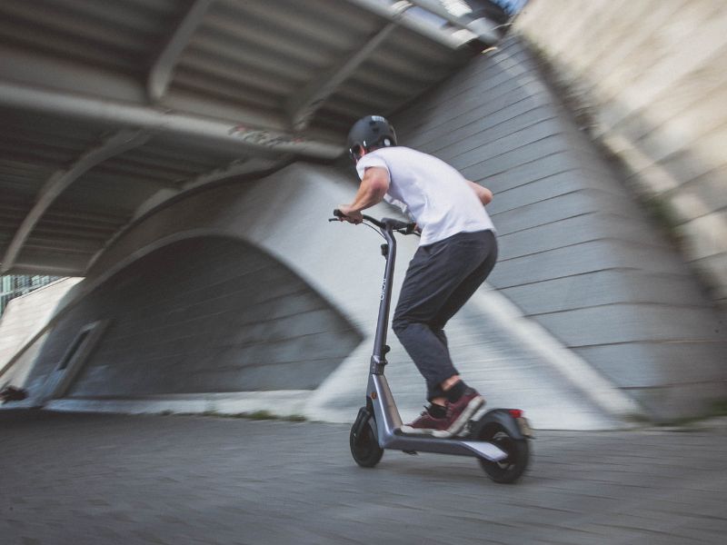 a man riding an electric scooter