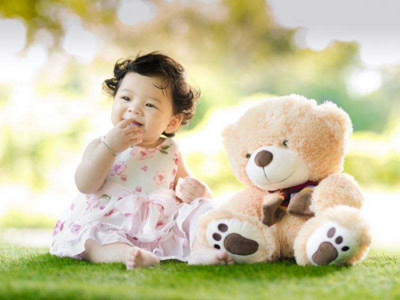 baby with teddy bear