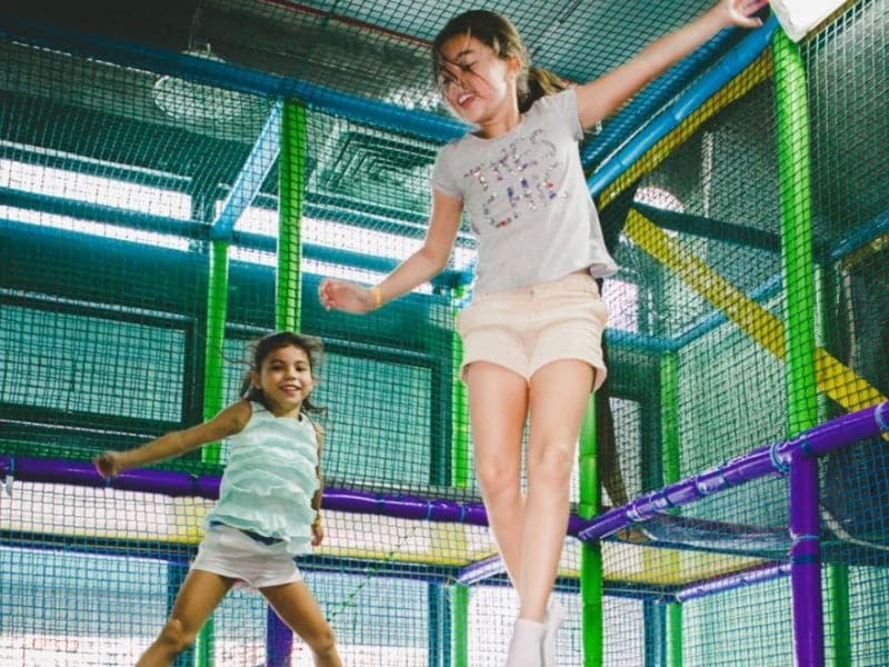 kids jumping on a trampoline