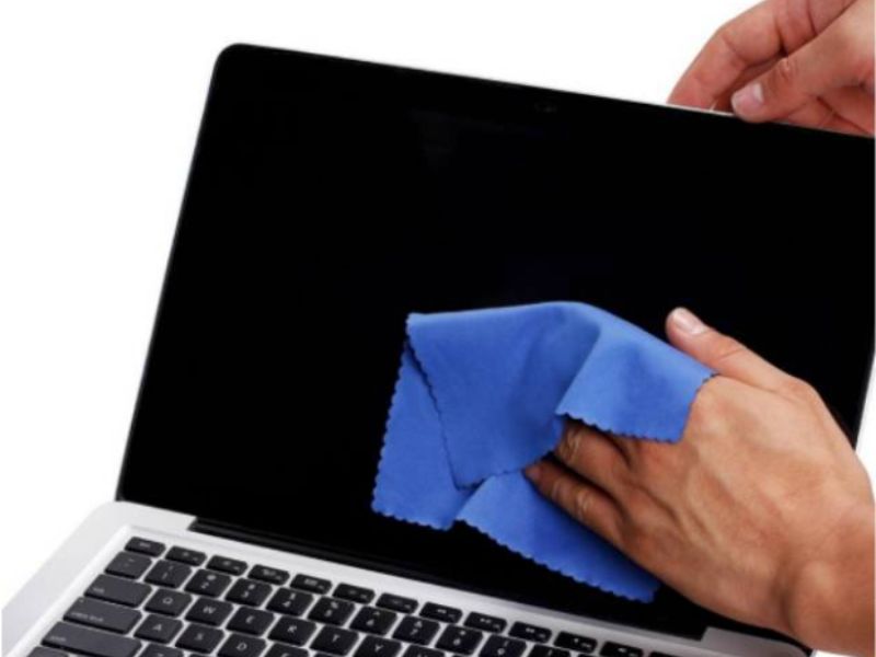 wiping a laptop screen