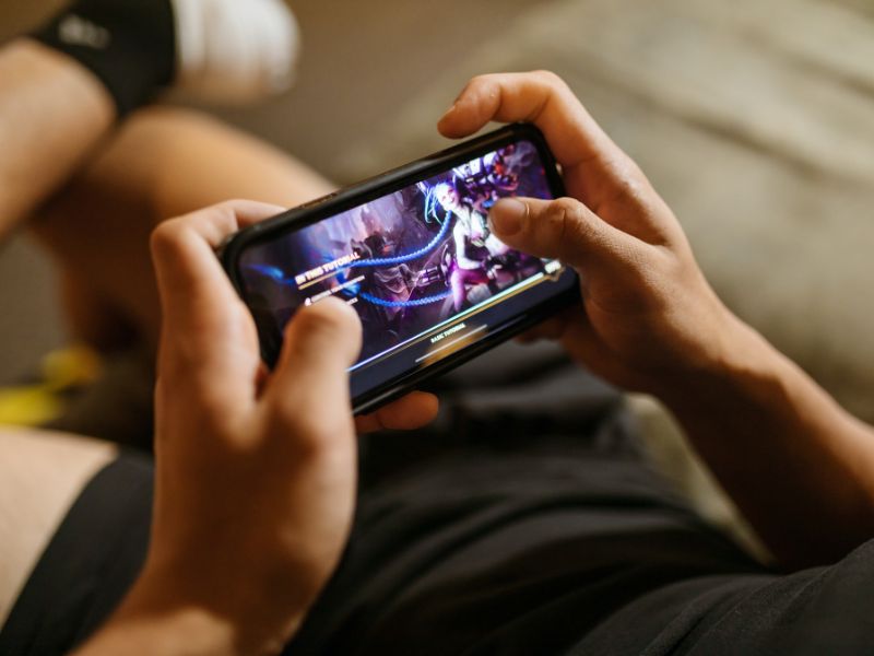 a person playing a mobile game