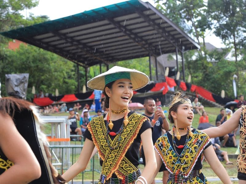 Women performers in traditional costume rainforest world music festival