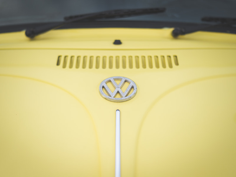 karak highway yellow volkswagen beetle