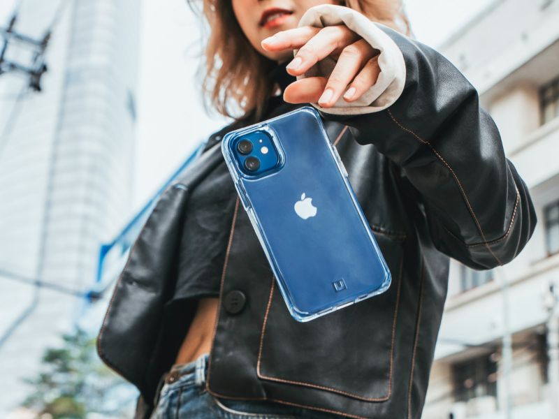 A woman letting go of a smartphone