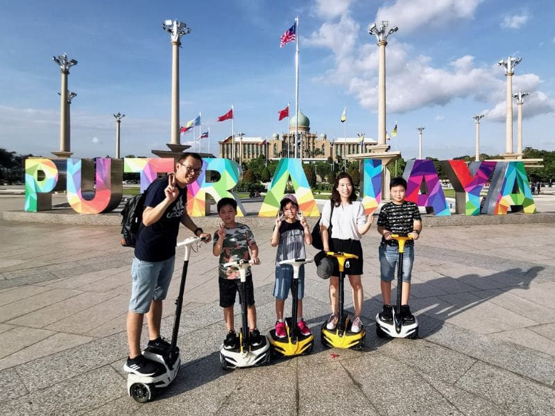 people riding Segways in Putrajaya Square things to do in putrajaya