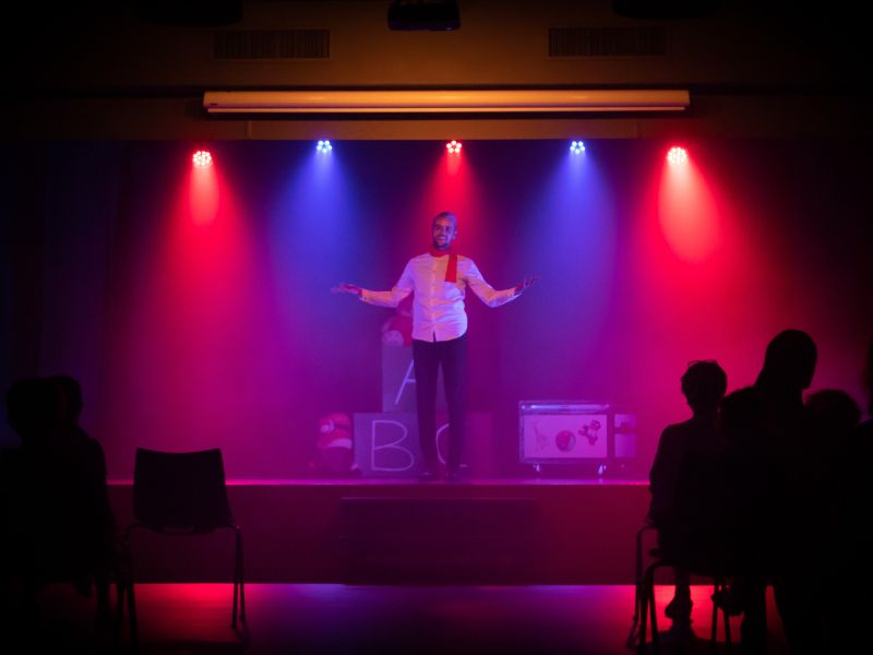 a man performing on stage father’s day celebration ideas