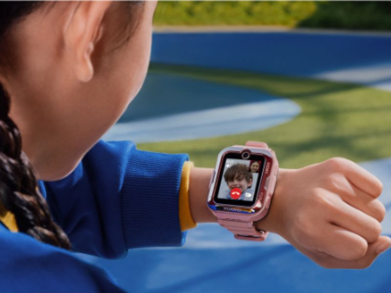 a kid looking at smartwatch