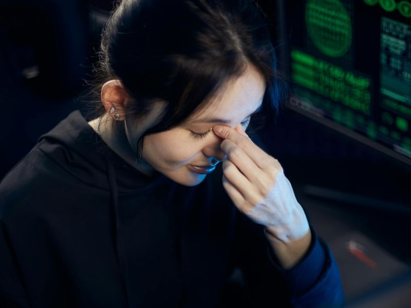 a woman pinching between her eyes best eye drops malaysia