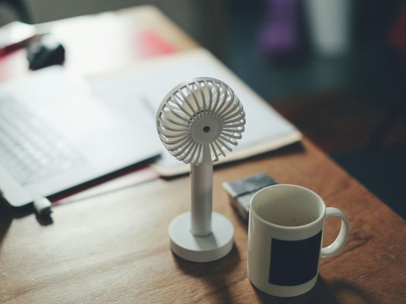 a portable mini fan on a table